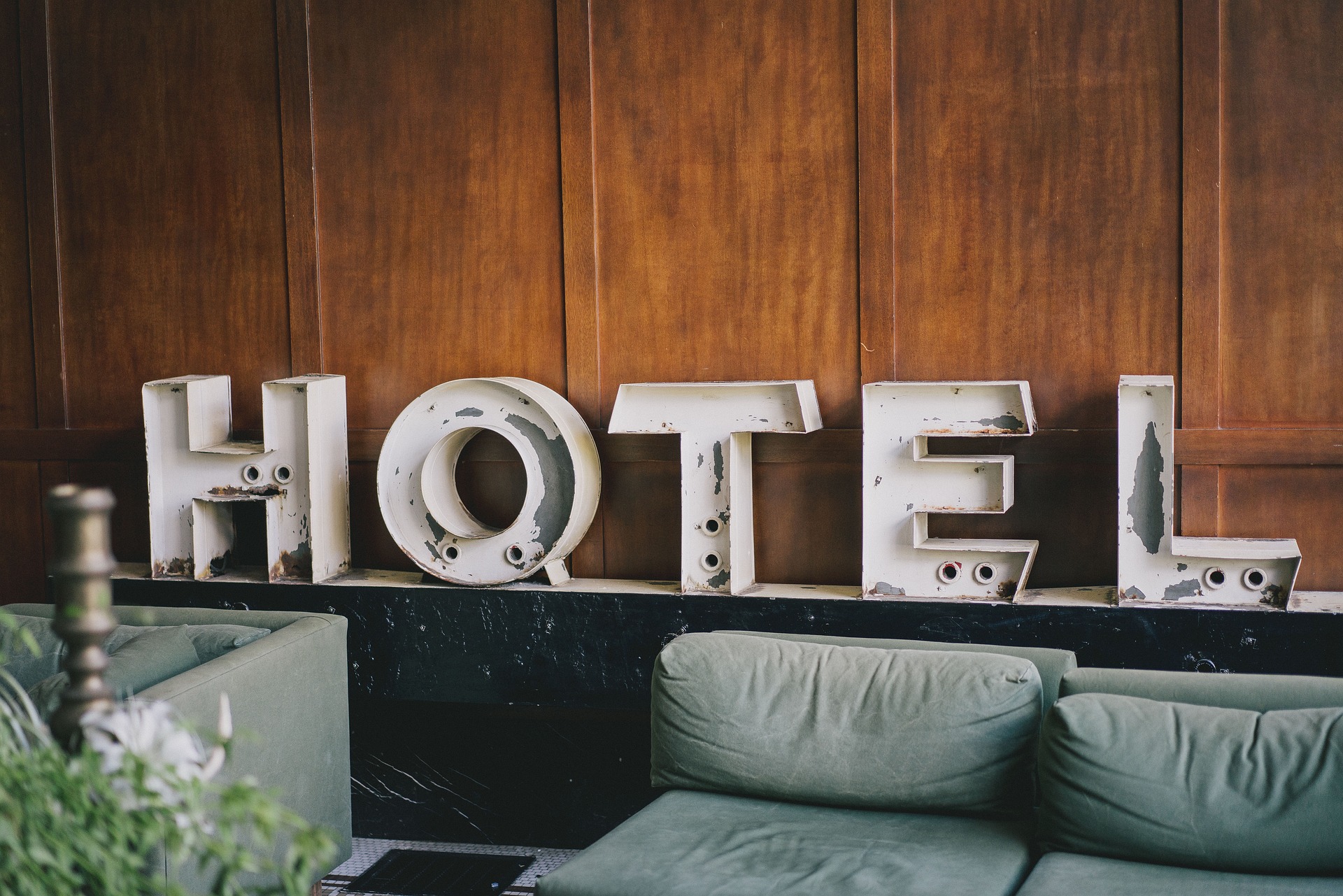 Metallic letters arranged to spell out the word Hotel.